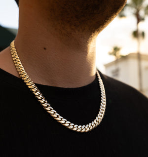Man wearing 10MM 14KT gold over silver Cuban link chain