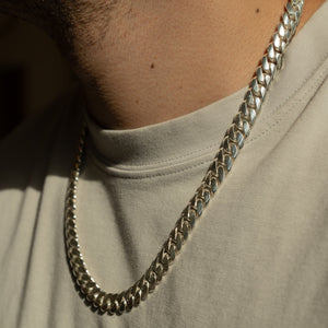 Man wearing 10MM solid silver Cuban link chain