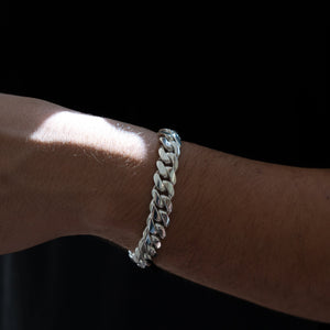 Man wearing 12MM solid silver Cuban link bracelet