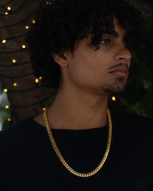 Man wearing 8MM 14KT gold over silver Cuban link chain