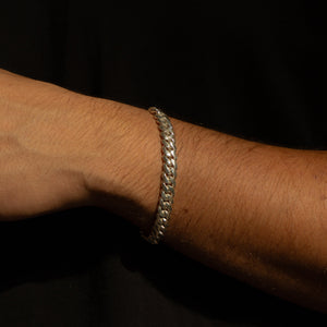 Man wearing 8MM solid silver Cuban link bracelet